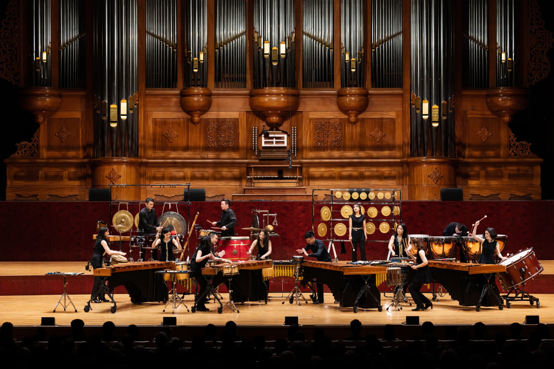 Ju Percussion Group performing on stage with marimbas, gongs and drums